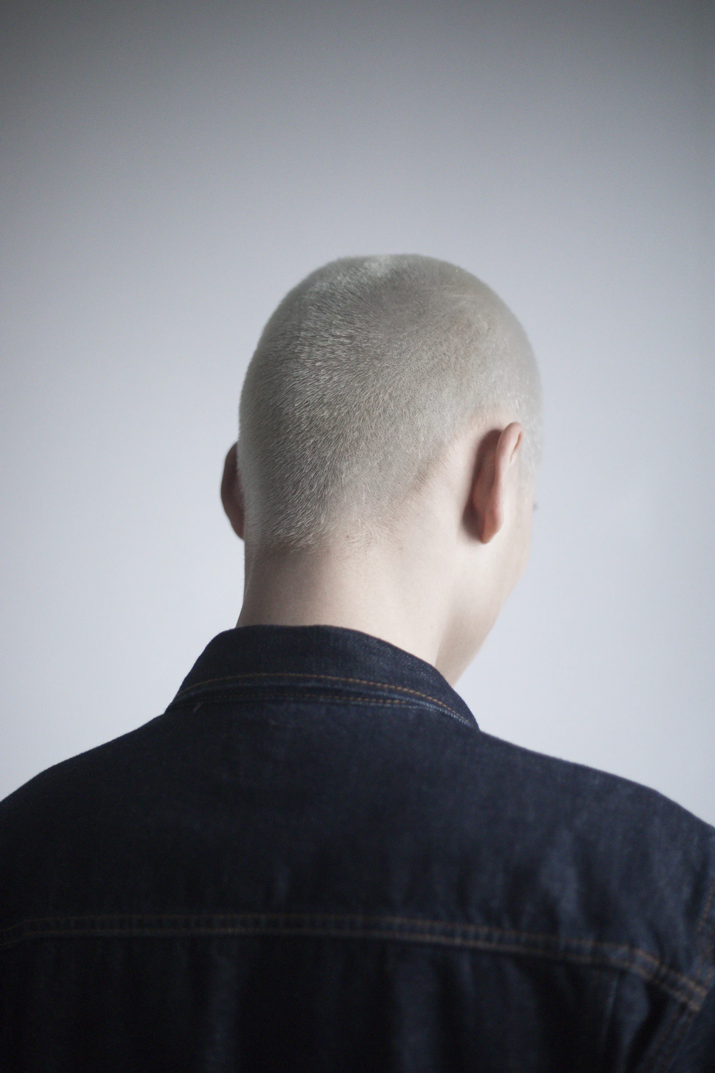 Back of a man's closely shaved head