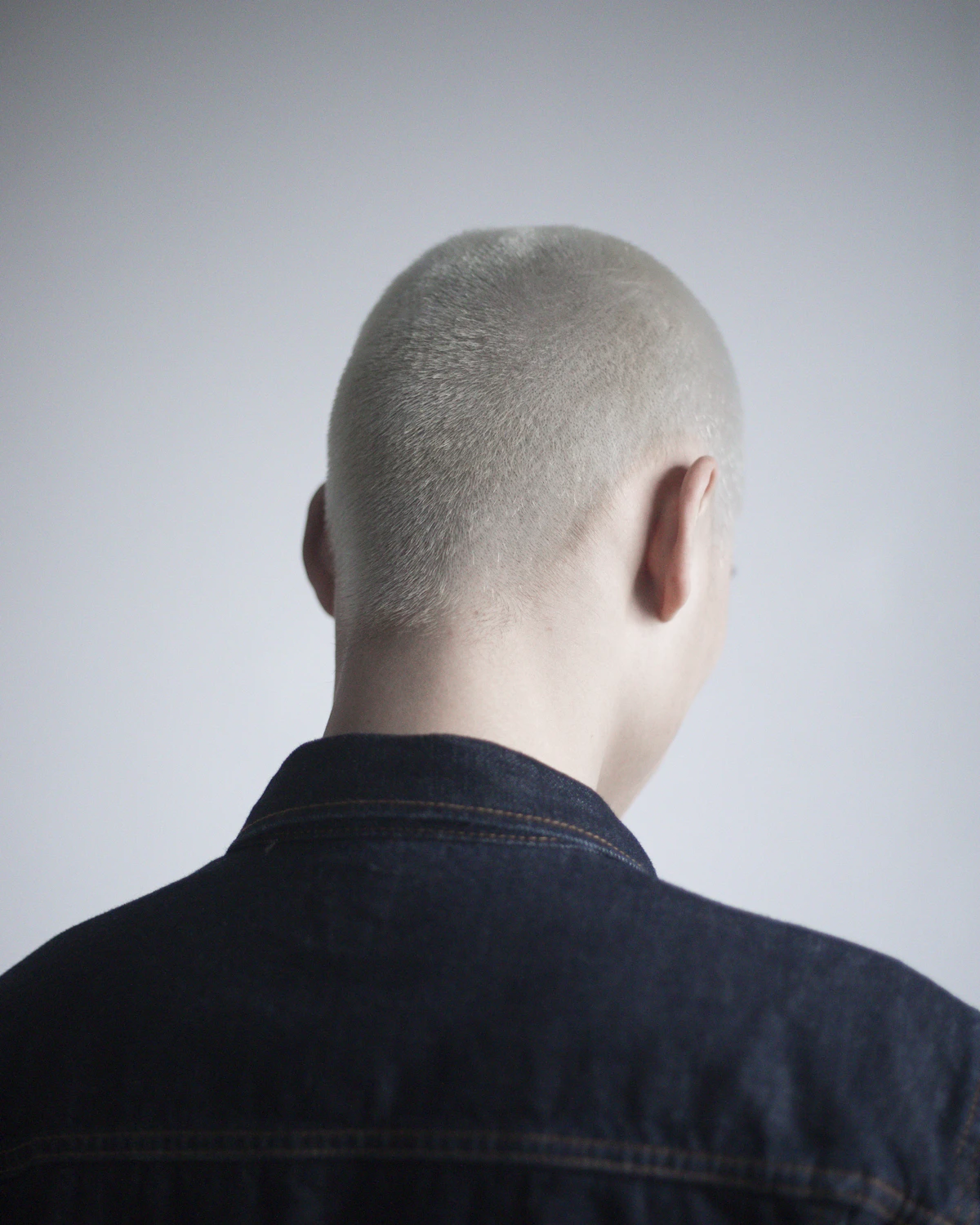 Back of a man's closely shaved head
